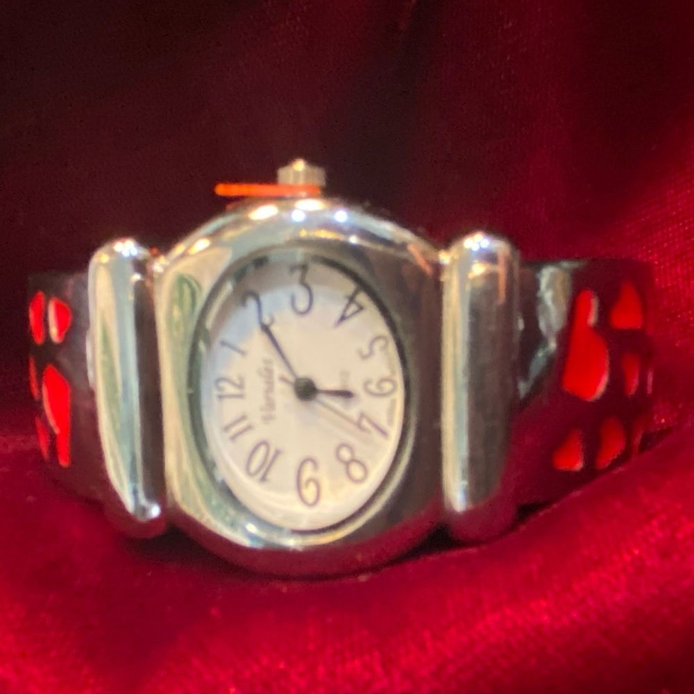 Versales Japan Movt Lady’s wrist watch. Silver with red hearts.